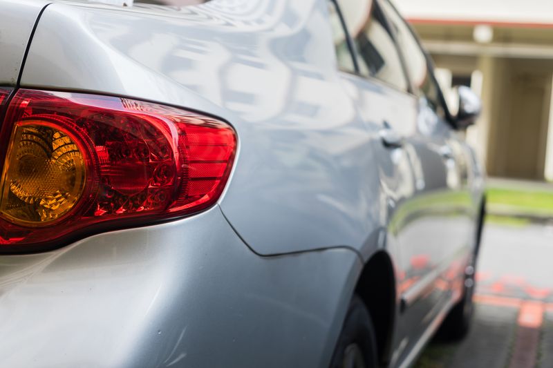 Rear of a freshly repaired silver car